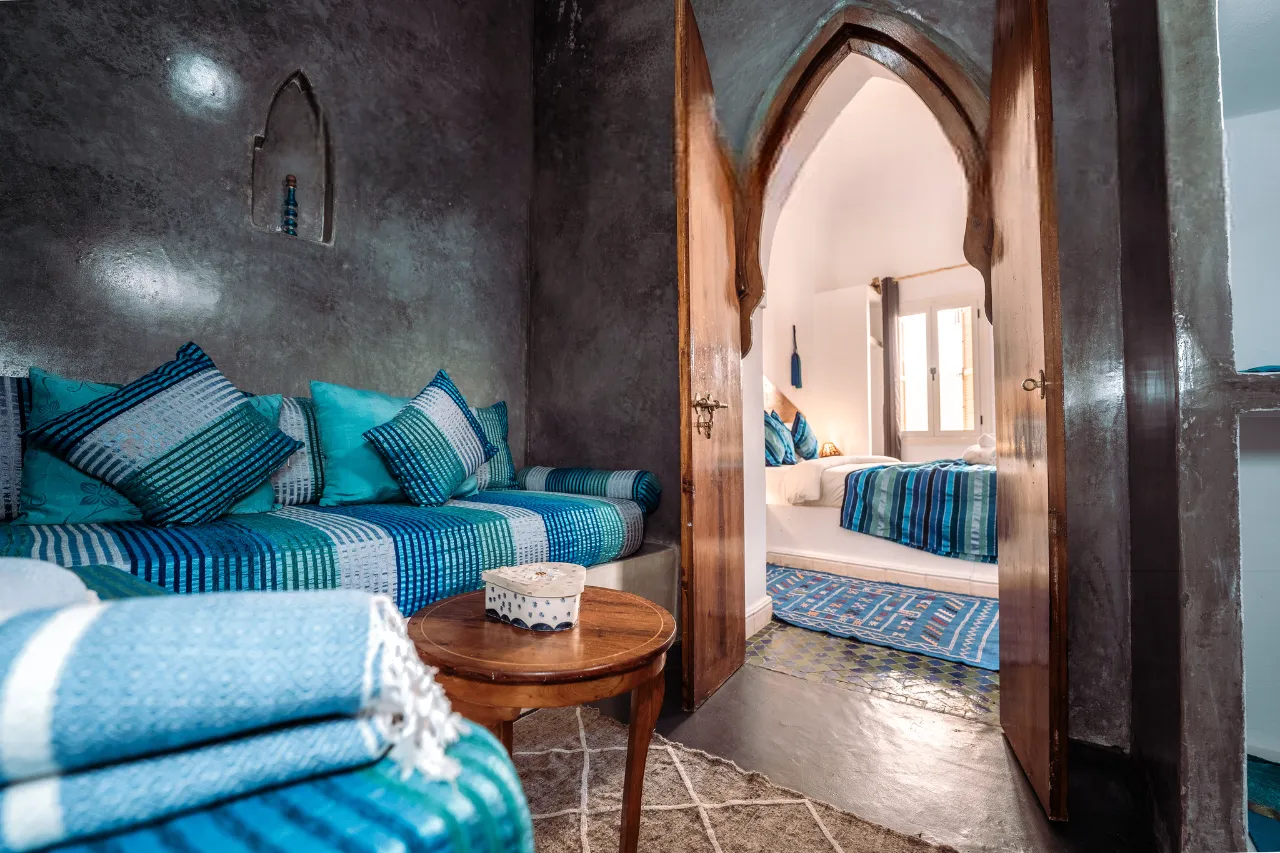 A blue seating nook bathed in soft light