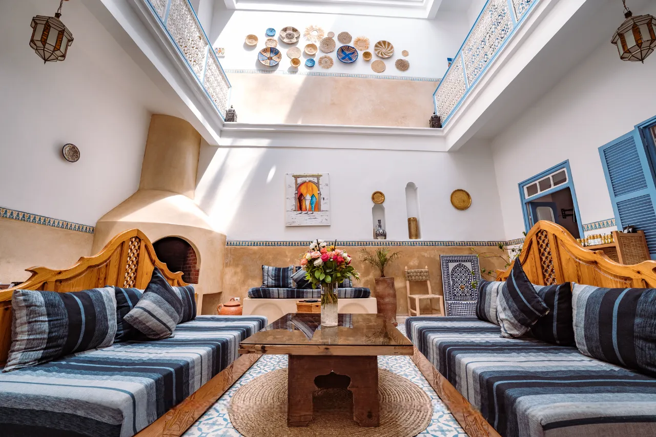 The sunlit plant-filled courtyard at the heart of Riad Amana